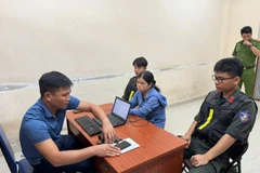 Đối tượng Nguyễn Thị Hoa Hường tại cơ quan Công an. (Ảnh: CACC)