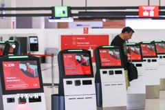 Quầy làm thủ tục tại sân bay Sydney, Australia. (Ảnh: THX/TTXVN)