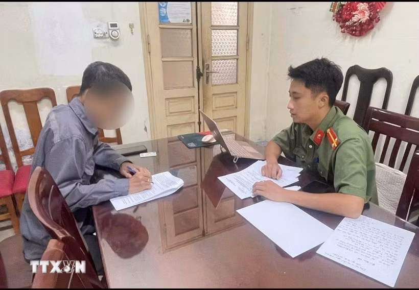 Ông N.N.T làm việc tại cơ quan Công an. (Ảnh: TTXVN phát)