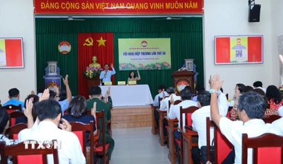 Các đại biểu tỉnh Đồng Nai dự hội nghị biểu quyết thống nhất danh sách chính thức những người ứng cử Đại biểu Quốc hội khóa XVI. (Ảnh: Lê Xuân/TTXVN)