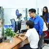 Thanh niên ra quân hỗ trợ vận hành chính quyền địa phương hai cấp. (Ảnh: Minh Đức/TTXVN)