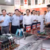 Bộ trưởng Bộ Giáo dục và Đào tạo Hoàng Minh Sơn và các đại biểu đã tham dự “Lễ ra mắt Không gian Đổi mới sáng tạo liên ngành Đại học Bách khoa Hà Nội”. (Ảnh: Thanh Tùng/TTXVN)