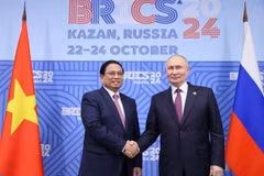 Trong khuôn khổ Hội nghị các Nhà lãnh đạo Nhóm các nền kinh tế mới nổi (BRICS) mở rộng tại Kazan, Liên bang Nga, tối 24/10/2024, Thủ tướng Phạm Minh Chính gặp Tổng thống Liên bang Nga Vladimir Putin, Chủ tịch Nhóm BRICS năm 2024. (Ảnh: Dương Giang/TTXVN)