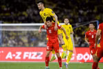 Đội tuyển Việt Nam (áo đỏ) nhận thất bại 0-4 trước Malaysia ở vòng loại Asian Cup 2027. (Ảnh: Malaysia NT)