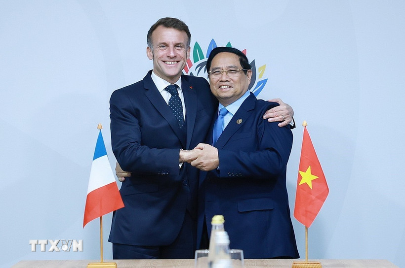 Thủ tướng Phạm Minh Chính gặp Tổng thống Pháp Emmanuel Macron. (Ảnh: Dương Giang/TTXVN)
