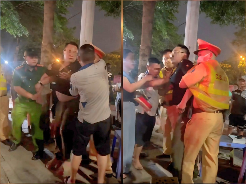 Lê Đình Chiến (áo đen) có biểu hiện say rượu, chống đối lực lượng chức năng. 