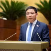 Bộ trưởng Bộ Tài chính Nguyễn Văn Thắng, thừa ủy quyền của Thủ tướng Chính phủ trình bày tờ trình dự án Luật sửa đổi, bổ sung một số điều của Luật Doanh nghiệp. (Ảnh: QH/Vietnam+)