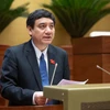 Chủ nhiệm Uỷ ban Văn hóa và Xã hội của Quốc hội Nguyễn Đắc Vinh trình bày Báo cáo giải trình, tiếp thu, chỉnh lý dự thảo Luật Việc làm (sửa đổi). (Ảnh: Vietnam+)