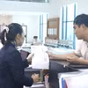 Các đơn vị trong toàn hệ thống Kho bạc Nhà nước đã chủ động phối hợp với cơ quan thu trên địa bàn để tập trung nhanh, hạch toán đầy đủ và kịp thời các khoản thu vào ngân sách. (Ảnh: Vietnam+)
