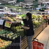 Trong tháng 12, tổng mức bán lẻ hàng hóa và doanh thu dịch vụ tiêu dùng theo giá hiện hành đạt gần 571 nghìn tỷ đồng, tăng 1,9% so với tháng trước và tăng 9,3% so với cùng kỳ năm trước. (Ảnh: Vietnam+)