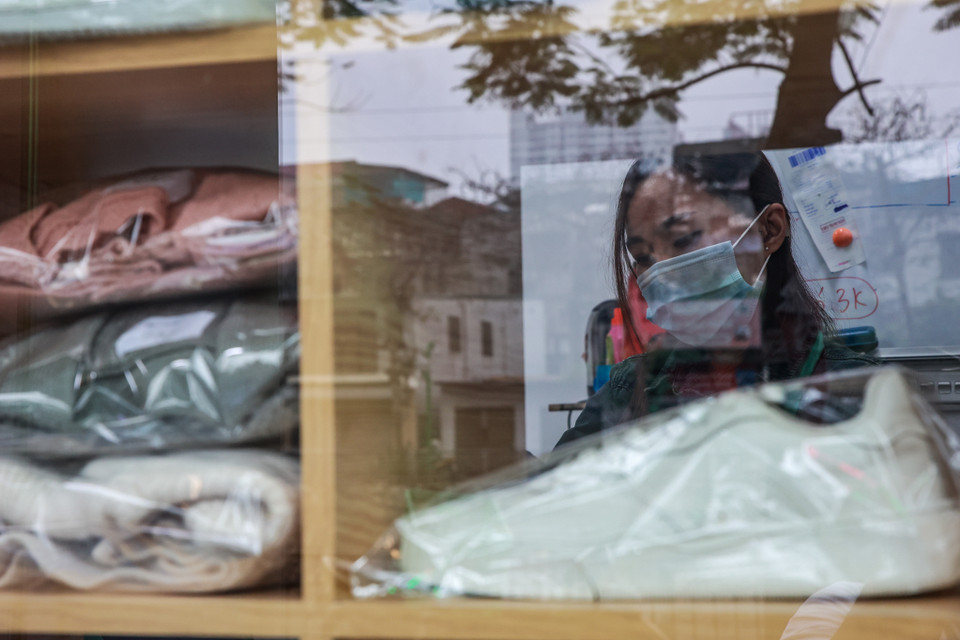 Cuối cùng, chị có cơ duyên kết nối với chủ thương hiệu nhượng quyền 'Giặt ký'. Đến tháng 12/2020 thì cửa hàng giặt là của người điếc ra đời. (Ảnh: Minh Sơn/Vietnam+)