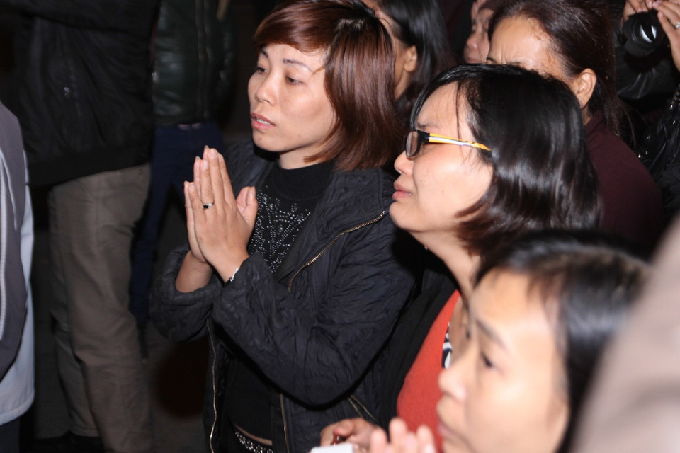 Anh Đạt ra đi quá đột ngột để lại chị cùng 2 đứa con thơ dại. (Ảnh Minh Sơn/Vietnam+)