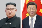 Chủ tịch Trung Quốc Tập Cận Bình (phải) và nhà lãnh đạo Triều Tiên Kim Jong Un. (Ảnh: Kyodo/TTXVN)