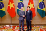 Chủ tịch nước Lương Cường đón Tổng thống Cộng hòa Liên bang Brazil Luiz Inácio Lula da Silva tới dự tiệc chiêu đãi. (Ảnh: Lâm Khánh/TTXVN)