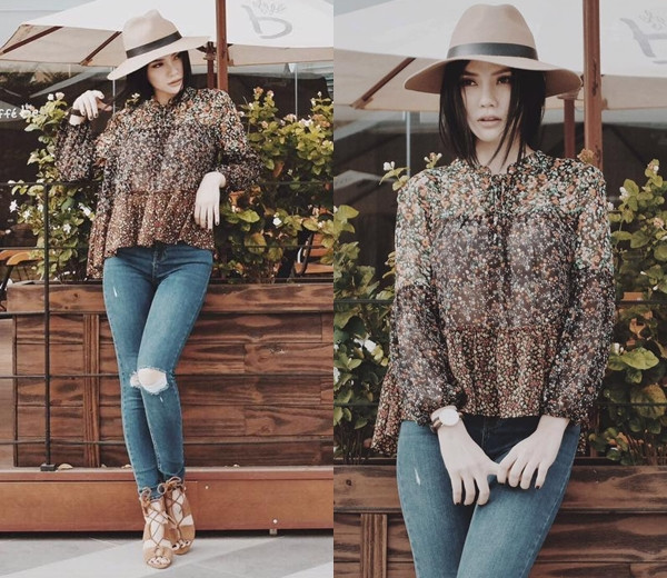 Set đồ sơmi họa tiết và quần jeans không thể tôn hết vẻ thời thượng của Thu Thủy nếu thiếu bộ đôi phụ kiện đồng màu camel là mũ vành tròn và sandals cao gót.