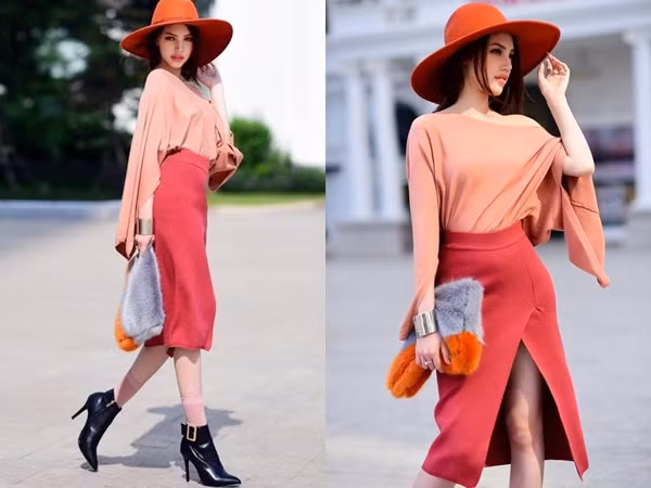 Hoa hậu Thế giới người Việt tại Úc - Jolie Nguyễn hết mực sành điệu trên phố với áo thun cách điệu màu hồng san hô, phối cùng chân váy xẻ tà gam màu hồng đỏ. Người đẹp khéo mix mũ vành tròn, clutch lông và bốt cao gót da làm phụ kiện nâng tầm cho bộ cánh.