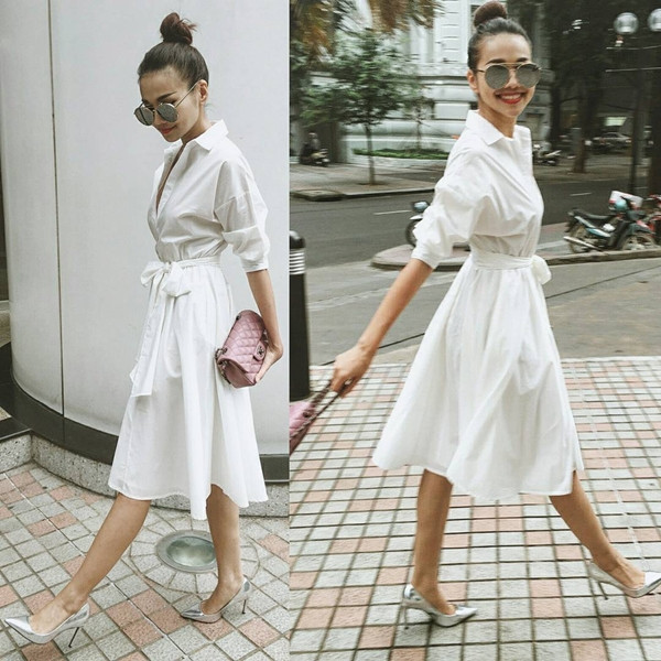 Diện đầm sơmi trắng chít eo duyên dáng và giày cao gót ánh bạc bắt mắt, Thanh Hằng chọn túi xách nhỏ và kính mắt tráng gương là đủ hút hồn trên phố.