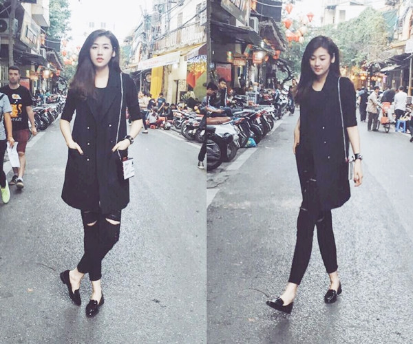 Mix nhiều lớp trang phục đồng điệu mang sắc đen tối giản, Á hậu Dương Tú Anh tạo điểm nhấn cho trang phục với túi đeo nhỏ gam màu sáng, tăng sự lôi cuốn.