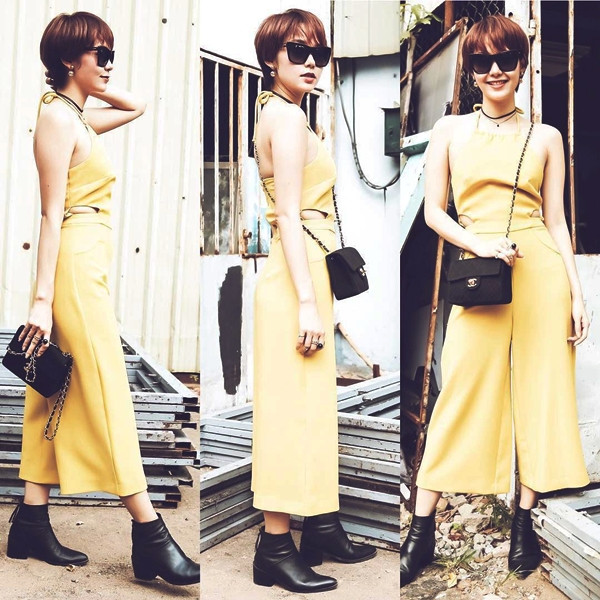 Để lộ lưng trần gợi cảm trong bộ jumpsuit cổ yếm màu vàng của Topshop, Minh Hằng gây ấn tượng mạnh khi xuất hiện cùng mái tóc tém. Diện mạo mới này giúp phong cách cô nàng càng thêm trẻ trung, hút hồn.