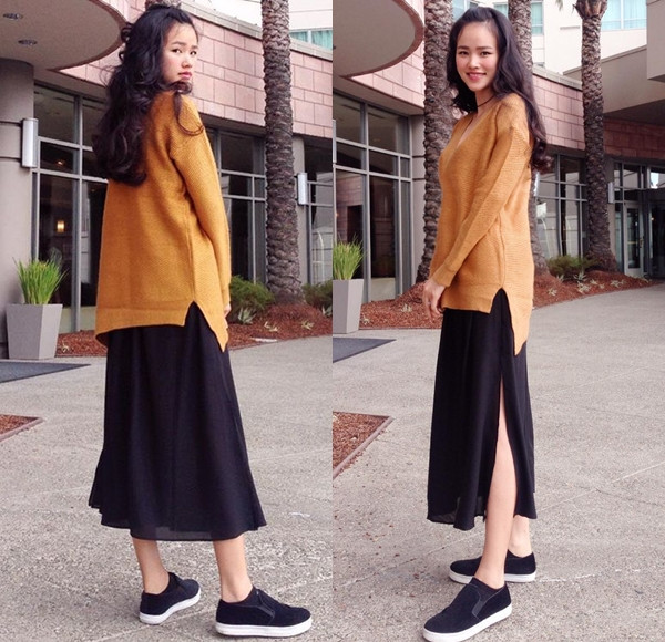 Khoe mái tóc mới với những nếp sóng xoăn nhẹ dịu dàng, người mẫu Tuyết Lan tự tin 'thả dáng' trên đường phố New York với váy midi (dài ngang bắp chân) xẻ hông cao, áo len màu cam đất và giày lười. 