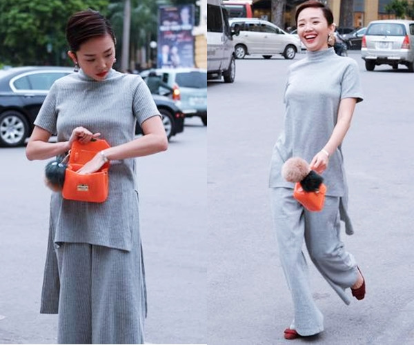 Chủ nhân 'Vũ điệu cồng chiêng' còn ghi điểm với người hâm mộ khi diện bộ đồ len xuống phố. Để tạo nét chấm phá cho trang phục màu ghi sáng, Tóc Tiên chọn phụ kiện màu sắc nổi bật là giày bệt đỏ rượu và túi xách nhỏ tông cam sáng.