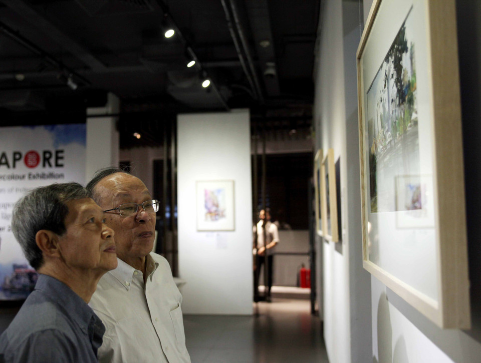 Đây là sự kiện do Đại sứ quán Singapore tại Hà Nội và Cộng đồng màu nước SWS phối hợp tổ chức nhân dịp kỷ niệm 50 năm ngày độc lập của Singapore (9/8/1965-9/8/2015). (Ảnh: Doãn Đức/Vietnam+)