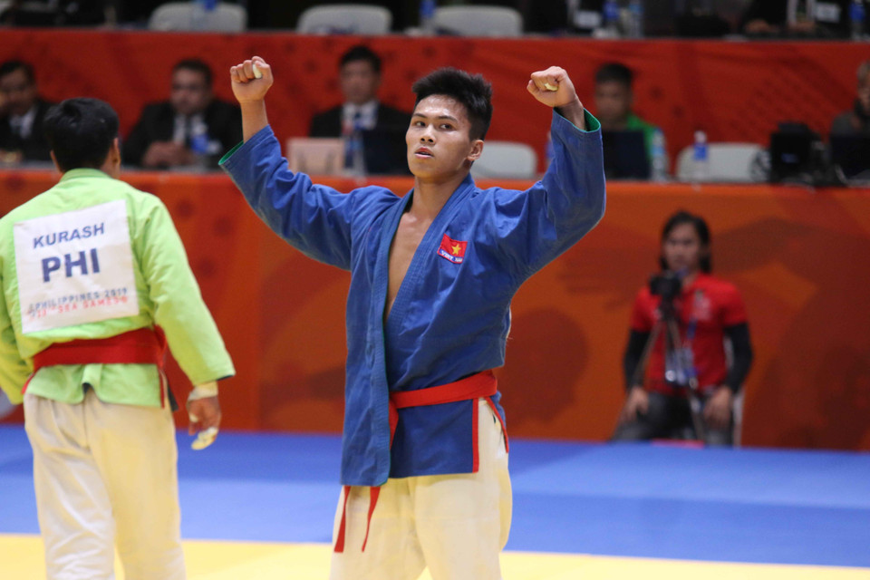 Võ sỹ Vũ Ngọc Sơn thi đấu ở hạng cân dưới 73kg nam. (Ảnh: Hoàng Linh/TTXVN)