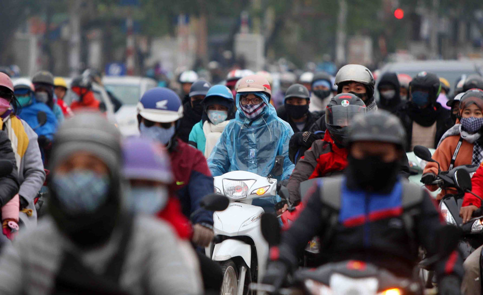 Người dân chen chúc đi lại trên tuyến đường Giải Phóng, cửa ngõ phía Nam Thủ có mật độ giao thông tăng cao vào chiều 1/1/2019. (Ảnh: Thanh Tùng/TTXVN)