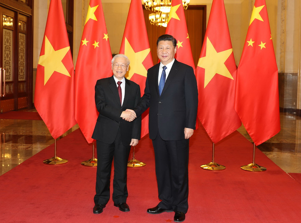 Tổng Bí thư, Chủ tịch nước Trung Quốc Tập Cận Bình đón Tổng Bí thư Nguyễn Phú Trọng. (Ảnh: Trí Dũng/TTXVN)