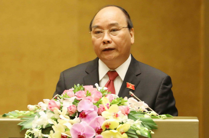  Thủ tướng Nguyễn Xuân Phúc trình bày Báo cáo về kết quả thực hiện kế hoạch phát triển kinh tế-xã hội năm 2017; kế hoạch phát triển kinh tế-xã hội năm 2018. (Ảnh: Phương Hoa/TTXVN)