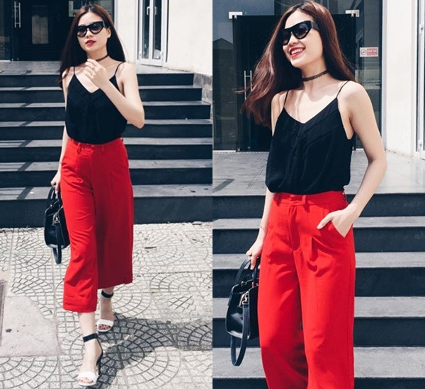 Á hậu Diễm Trang hóa quý cô sành điệu cùng áo hai dây và quần culottes gam đỏ rực rỡ. Những sắc màu tương phản giúp vẻ tươi tắn của cô càng thêm nổi bật.