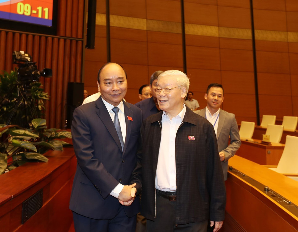 Tổng Bí thư, Chủ tịch nước Nguyễn Phú Trọng với Thủ tướng Nguyễn Xuân Phúc tại Phiên chất vấn chiều 8/11. (Ảnh: Trí Dũng/TTXVN)