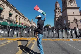 Người dân Mexico biểu tình yêu cầu làm rõ vụ việc và đảm bảo an ninh khu vực. (Nguồn: AFP/Getty Images)