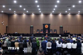 Các bị cáo tại phiên tòa xét xử chiều 14/1. (Ảnh: Phạm Kiên/TTXVN)