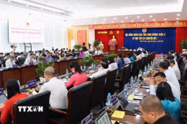 Bình Dương thông qua Nghị quyết về việc tán thành chủ trương sắp xếp đơn vị hành chính cấp tỉnh, cấp xã. (Ảnh: Văn Hướng/TTXVN)