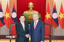 Tổng Bí thư Tô Lâm gặp Tổng Bí thư, Chủ tịch nước Lào Thongloun Sisoulith. (Ảnh: Thống Nhất/TTXVN)