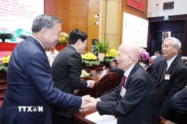 Tổng Bí thư Tô Lâm và các đại biểu tham dự buổi gặp mặt. (Ảnh: Thống Nhất/TTXVN)
