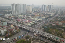 Tăng tính minh bạch thông qua việc mở rộng áp dụng bảng giá đất. (Ảnh: TTXVN phát)