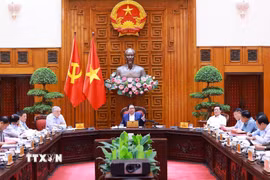 Thủ tướng Phạm Minh Chính chủ trì họp triển khai kế hoạch phân cấp, phân quyền khi thực hiện mô hình tổ chức chính quyền địa phương 2 cấp. (Ảnh: Dương Giang/TTXVN)