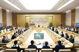 Hội nghị tổng kết “Chiến dịch Quang Trung” xây dựng lại nhà cho các gia đình bị thiệt hại do bão lũ tại miền Trung. (Ảnh: Dương Giang/TTXVN)