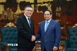 Thủ tướng Phạm Minh Chính tiếp ông Hồng Thiên Chúc, Chủ tịch Tập đoàn Texhong (Trung Quốc). (Ảnh: Dương Giang/TTXVN)