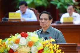 Thủ tướng Phạm Minh Chính phát biểu tại hội nghị tiếp xúc cử tri thành phố Cần Thơ trước Kỳ họp thứ 10, Quốc hội khóa XV. (Ảnh: Dương Giang/TTXVN)