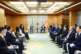 Thủ tướng Phạm Minh Chính tiếp Chủ tịch Tập đoàn xây dựng Thái Bình Dương Nghiêm Giới Hòa. (Ảnh: Dương Giang/TTXVN)