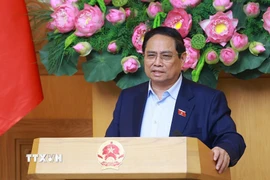 Thủ tướng Phạm Minh Chính chủ trì họp đánh giá tác động của các cuộc xung đột trên thế giới ảnh hưởng đến tình hình kinh tế-xã hội trong nước. (Ảnh: Dương Giang/TTXVN)