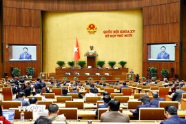 Bộ trưởng Bộ Tài chính Nguyễn Văn Thắng, thừa ủy quyền của Thủ tướng Chính phủ trình bày Tờ trình về 05 dự án: Luật Đầu tư (sửa đổi); Luật sửa đổi, bổ sung một số điều của Luật Quản lý nợ công; Luật sửa đổi, bổ sung một số điều Luật Kinh doanh bảo hiểm; Luật sửa đổi, bổ sung một số điều của Luật Thống kê; Luật sửa đổi, bổ sung một số điều của Luật Giá. (Ảnh: Doãn Tấn/TTXVN)