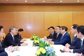 Thủ tướng Phạm Minh Chính gặp Thủ tướng Trung Quốc Lý Cường. (Ảnh: Dương Giang/TTXVN)