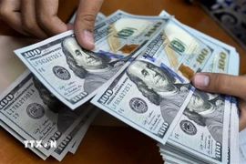 Đồng USD. (Ảnh: AFP/TTXVN)