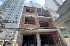 Một công trình nhà dân đang xây dựng dang dở và bị ảnh hưởng bởi giá cát xây dựng tăng cao. (Ảnh: Thanh Phong/Vietnam+) 