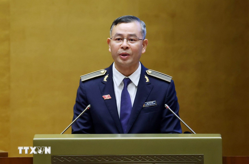 Tổng Kiểm toán Nhà nước Ngô Văn Tuấn trình bày Báo cáo công tác nhiệm kỳ 2021-2026 của Kiểm toán Nhà nước. (Ảnh: Phạm Kiên/TTXVN)