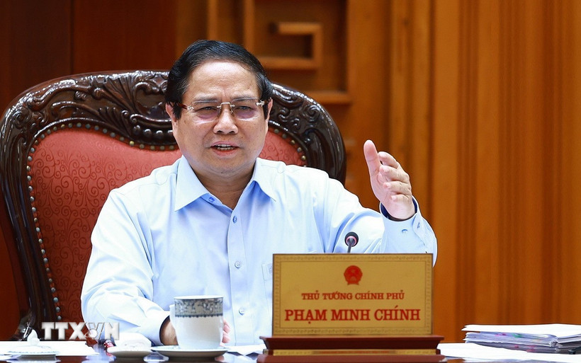 Thủ tướng Phạm Minh Chính chủ trì họp Thường trực Chính phủ với các bộ, ngành và Đoàn đàm phán Chính phủ về các vấn đề thương mại với Hoa Kỳ. (Ảnh: Dương Giang/TTXVN)
